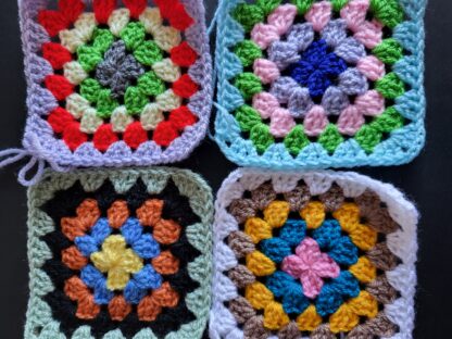 Crocheted granny squares of yarn