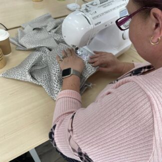 Lady using a sewing machine