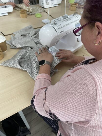 Lady using a sewing machine