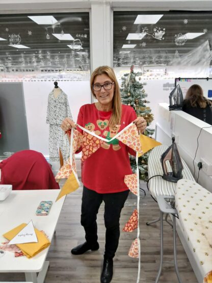 A lady holding her handmade bunting