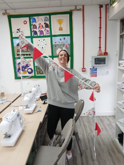 Lady showing her handmade bunting