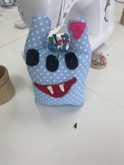 Handmade mini worry monster made by hand during a sewing workshop