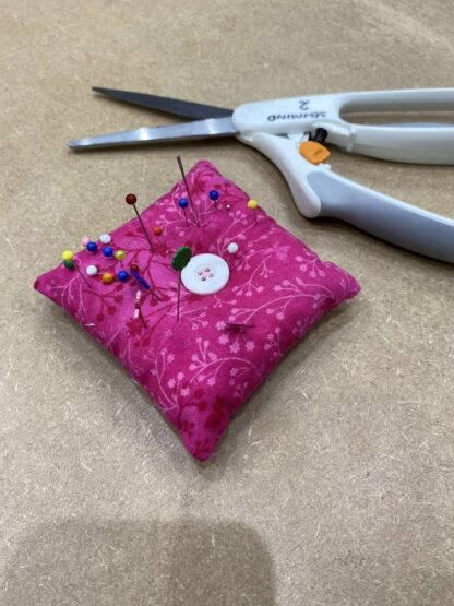 Pin cushion on a cutting table
