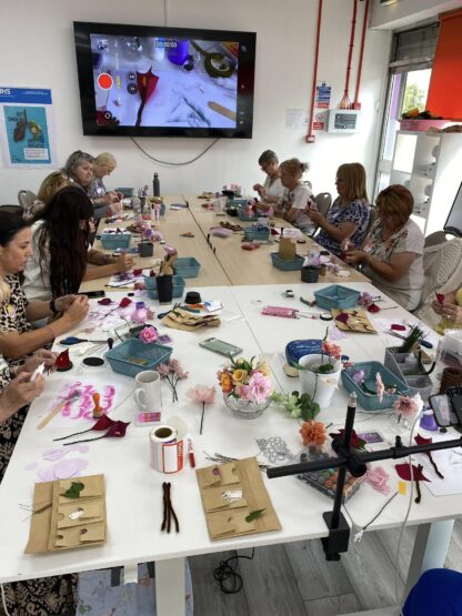 Group making paper crafts flowers