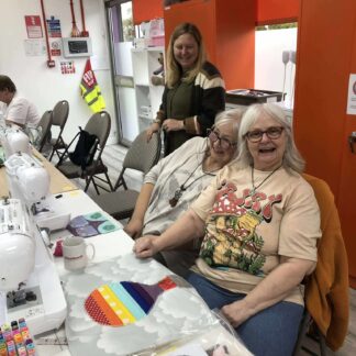 ladies smiling while crafting