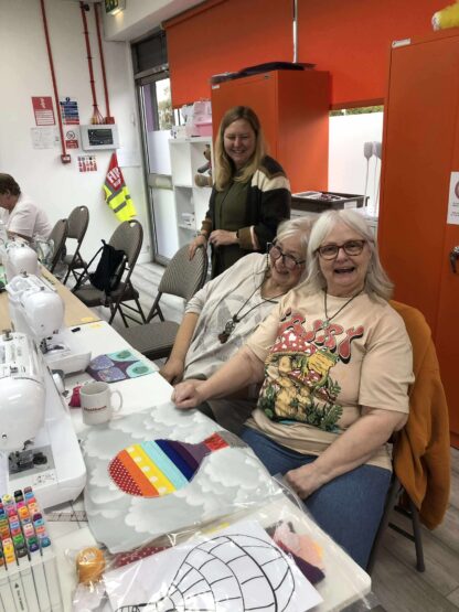 ladies smiling while crafting