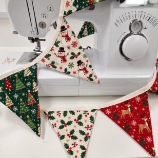 Christmas bunting wrapped around a sewing machine