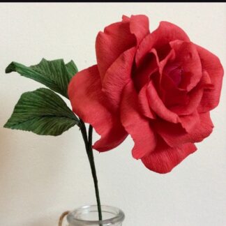 this is an image of a paper flower rose displayed in a vase