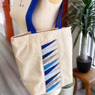 Tote bag displayed on a mannequin