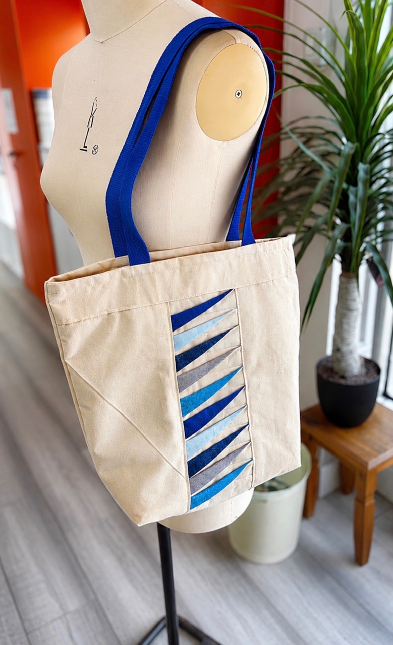 Tote bag displayed on a mannequin