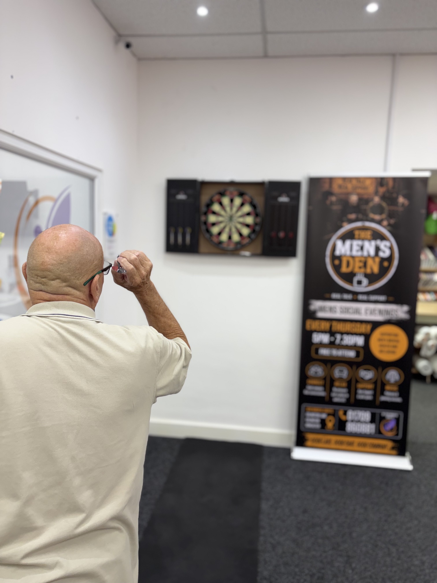 Guy playing darts