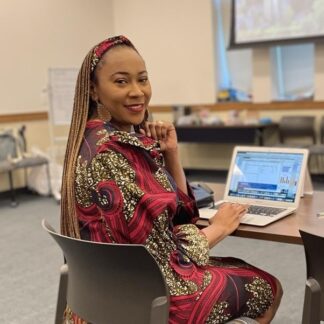 stella from sew mindful crafts Doncaster posing in front of a laptop